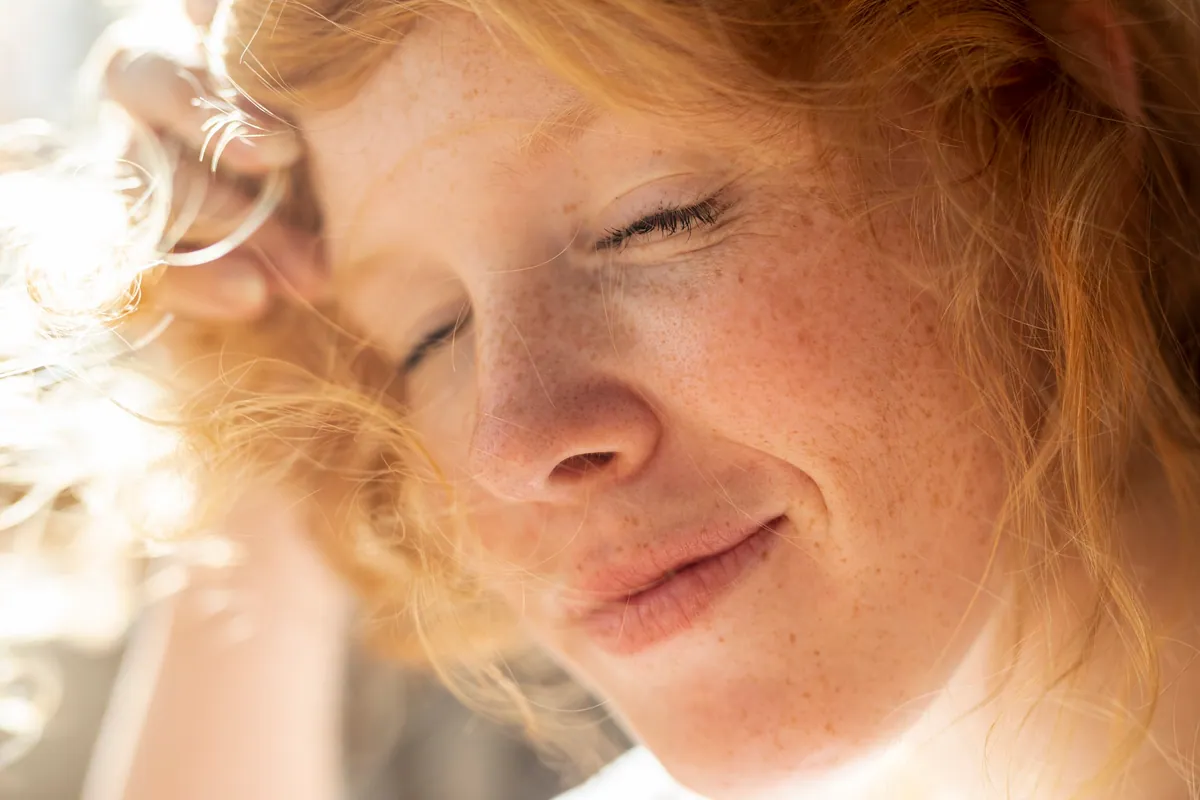 Serene woman with clear, healthy skin